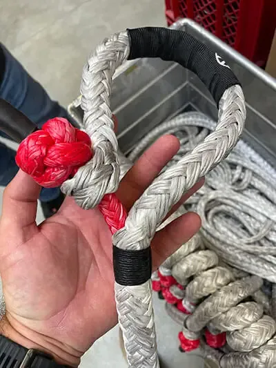 Locky holding a soft shackle at LIROS Ropes